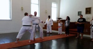 Slam, teaching a technique to a karate student